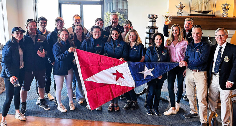 SFYC sailors with large burgee