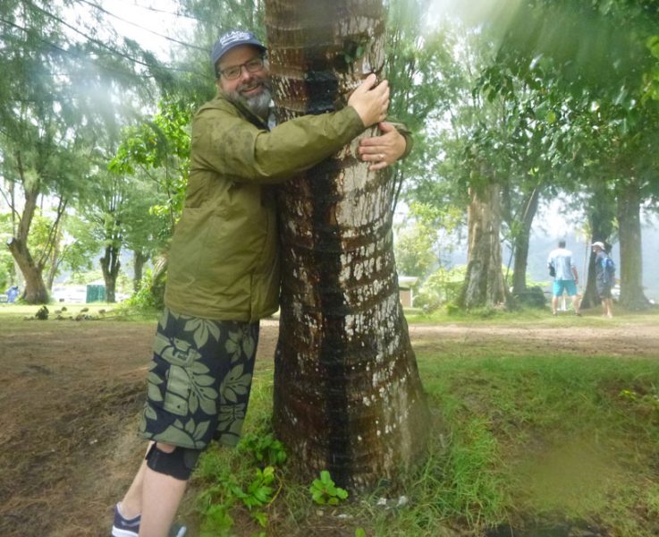 Randy Leasure hugs a tree