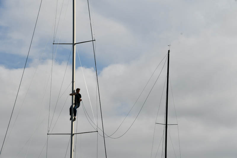 Neighbors boat is a help John Kearny Up the mast of Oaxaca