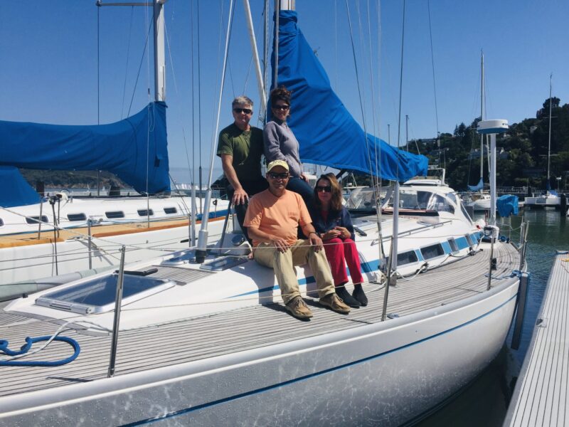 Four sailors together on deck