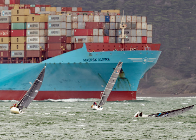 Maersk ship, racers, capsized boat