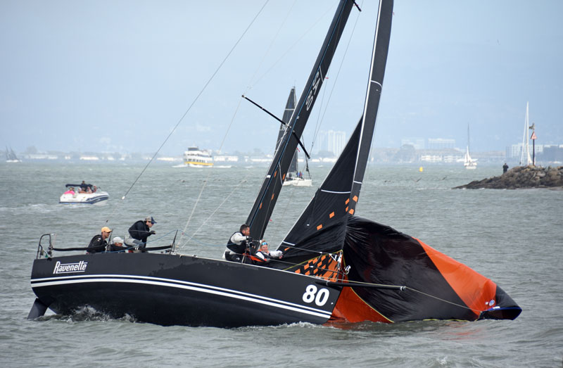 Ravenette aground, dropping spinnaker.