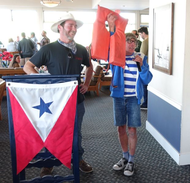 Hans and Stephen at podium with orange horseshoe lifejacket