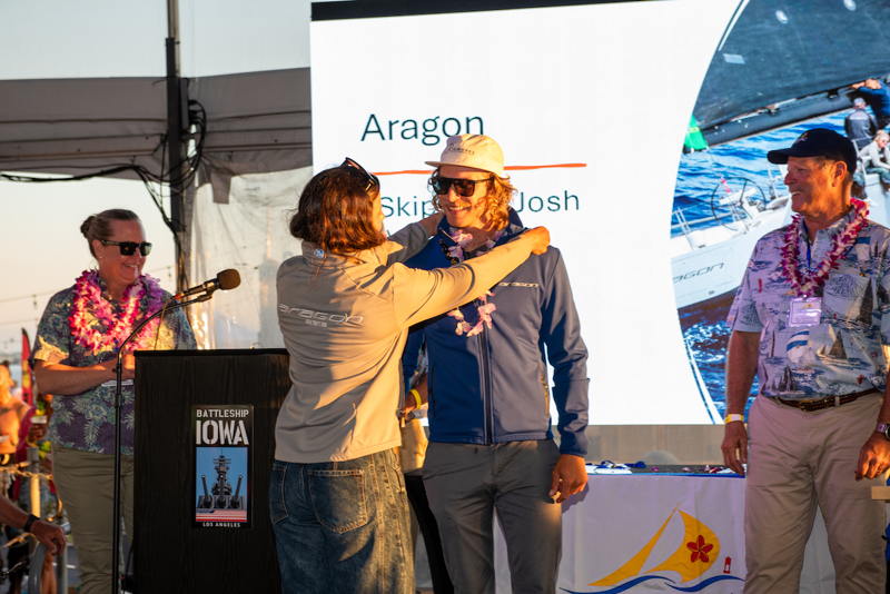 A lei is draped over Josh Axler from the Martens 72 Aragon by crew Nellee Gregor.
