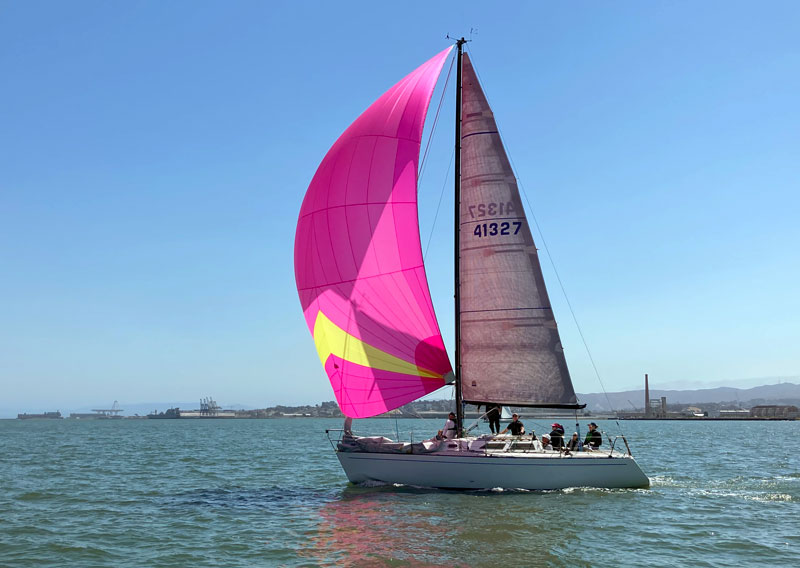 Olson 911 Heart of Gold with hot pink spinnaker