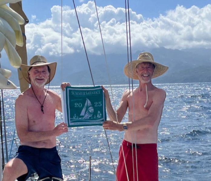 Ken Austin and Tom Neukranz arrive in Hiva Oa on Summer Sailstice.