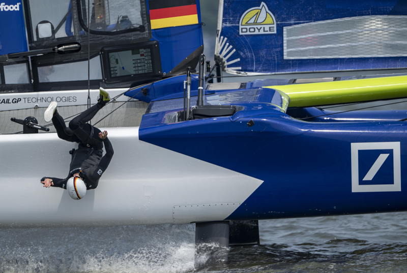 Jonathan Knottnerus-Meyer, grinder of Germany SailGP Team presented by Deutsche Bank, hangs off the edge of the Germany SailGP Team presented by Deutsche Bank F50 catamaran during a practice session ahead of the Mubadala New York Sail Grand Prix in New York, USA. Friday 6 June 2025. Rolex SailGP Championship Event 6 Season 2025.