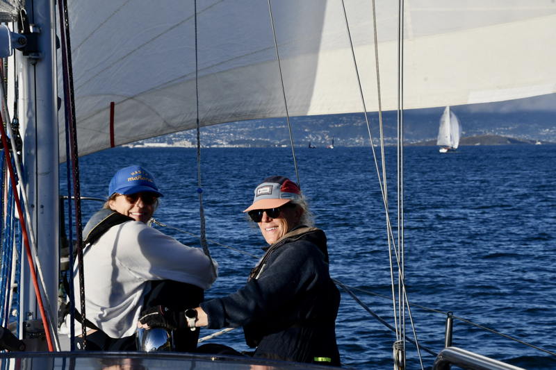 The mother-daughter foredeck crew of Kate and Jennifer Gridley took time to catch up between jibes.