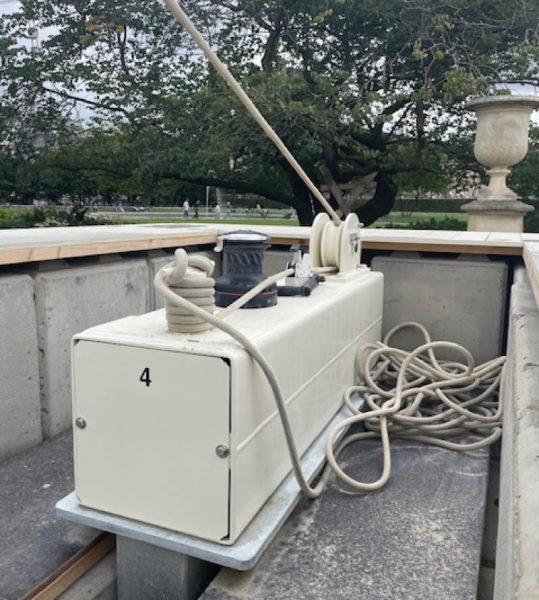 Sailors stand ready to keep the orb under control with Harken winches.