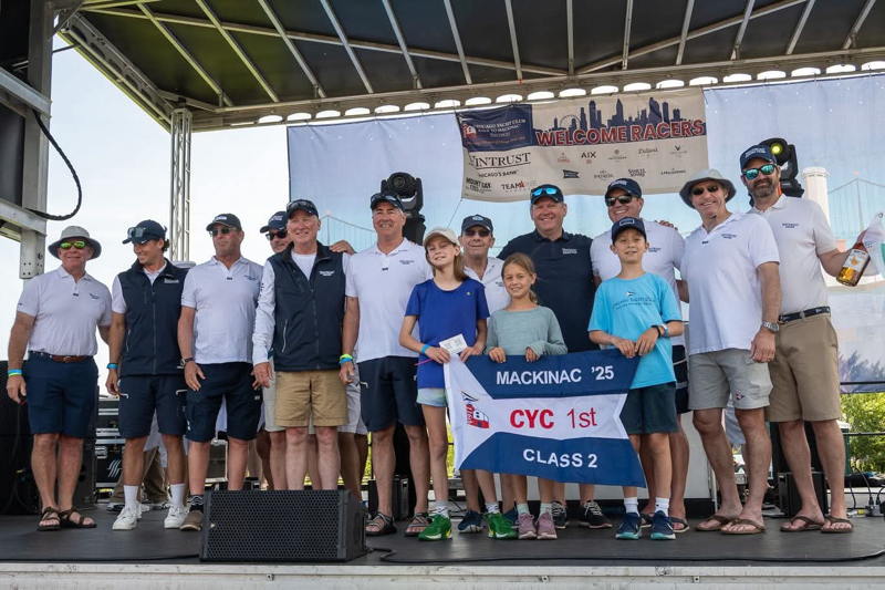 Kids join the full Sic Parvis Magna at the awards ceremony.