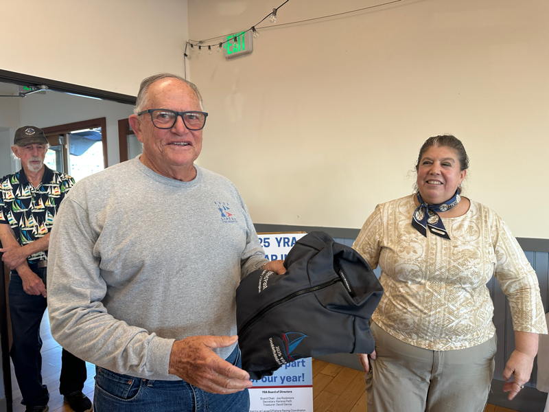 Kim Desenberg was on hand to pick up his trophy for winning Spinnaker 2 aboard his Wyliecat 39 Checkered Past.