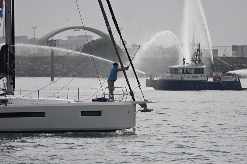 The San Diego Harbor Police give the fleet their full water canon send-off. 