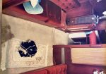 Main Saloon - Brass port lights, Table (on the forward bulkhead) lowers and opens up to double the size