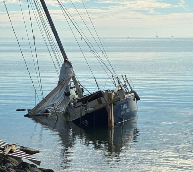 A derelict and abandoned vessel in Oyster Cove in the South Bay.