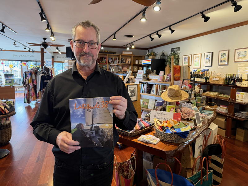 Jeff Battis holds the very last copy of the February issue of Latitude 38 two days before the arrival of the March issue.