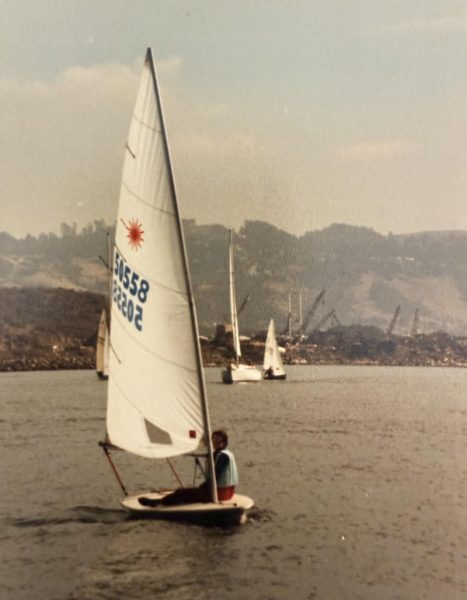 Peter Molnar sailing a Laser along the industrial wasteland of the Richmond shoreline in the 70s.