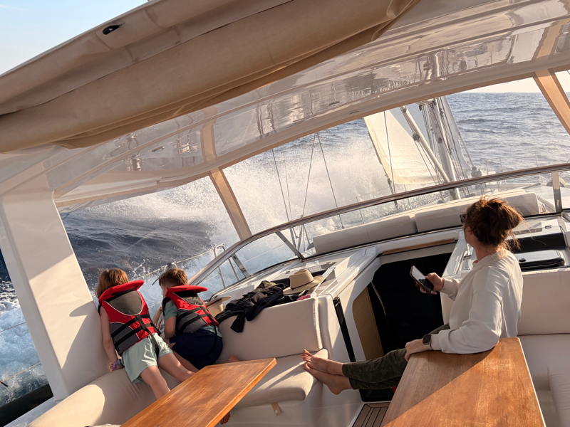 Mom and the kids exhilarated by a fresh breeze on the Turkish coast.