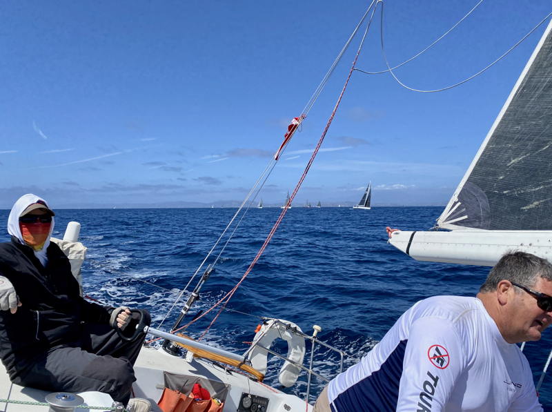 Author Andy Schwenk with eyes ahead as Juno sails upwind on the downwind course.
