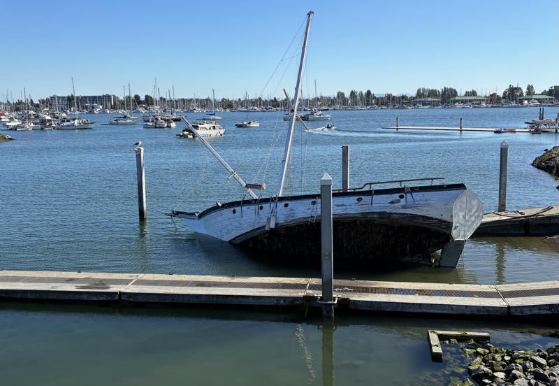 Abandoned boats on the Jack London Aquatic Center launch ramp with illiegally moored boats in the background.
