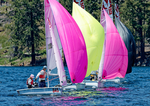 Melges 15s racing with colorful spinnakers on Huntington Lake