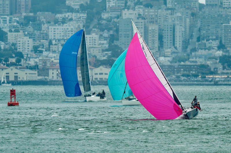 Sailing adds color to a grey Bay.