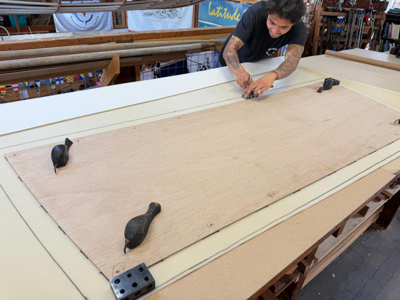 Just prior to the crew party on of the crew at Spaulding Marine Center was practicing his craft to create a new headliner for a lobster boat.