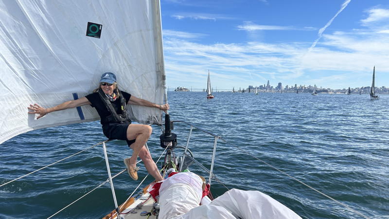 Velina Barnes helps the jib catch the limited breeze. 