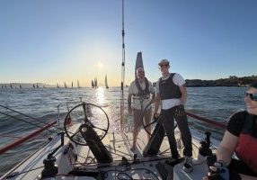 Captain Nick Grebe with crew Steve and Bridgette coming down the home stretch.