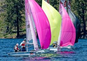 Melges 15s racing with colorful spinnakers on Huntington Lake