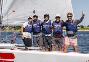 Morgan Pinckney (far right) and his team from NHYC celebrate winning the 2026 Youth Match Racing World Championship in Denmark. 