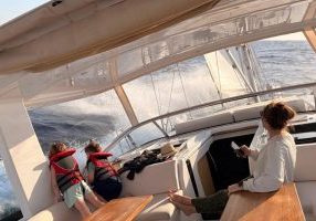 Mom and the kids exhilarated by a fresh breeze on the Turkish coast.