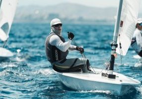 Al Sargent beating the Greek heat near the windward mark.
